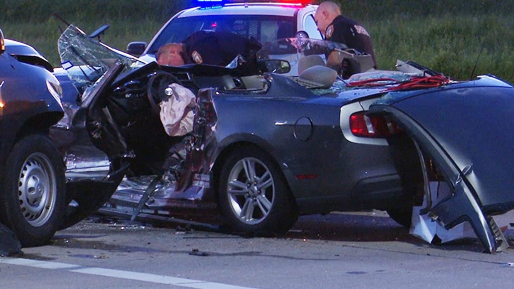 Firefighters cut roof off Mustang to free trapped woman after crash near Katy