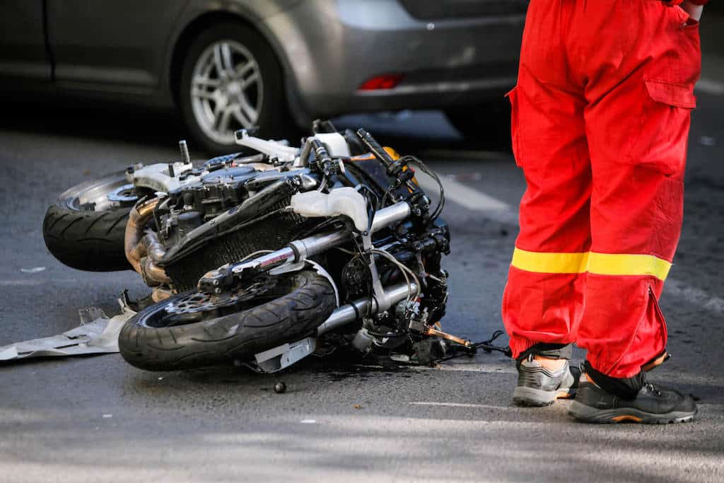 Crashed Motorcycle Next To A Person